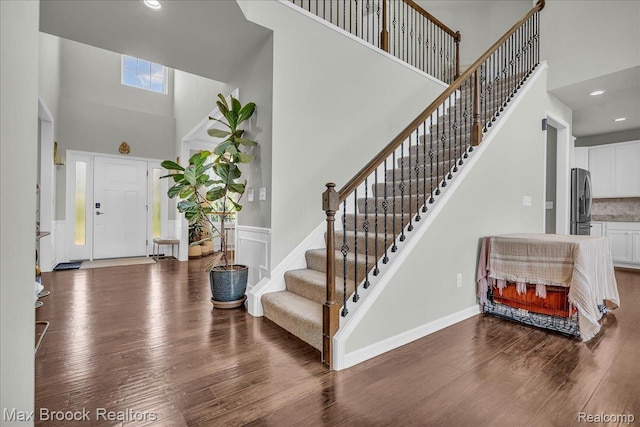 1043 Kendall Ct, Lake Orion, MI 48360 - foyer with a high ceiling, wood finished floors, stairs, and recessed lighting
