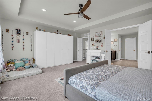 1043 Kendall Ct, Lake Orion, MI 48360 - carpeted bedroom featuring recessed lighting, a raised ceiling, and a ceiling fan