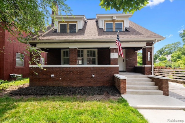 1725 Seyburn St, Detroit, MI 48214 - bungalow-style home with covered porch, brick siding, and roof with shingles