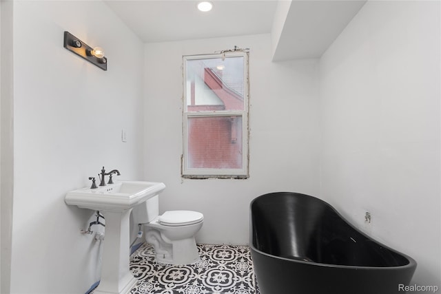 1725 Seyburn St, Detroit, MI 48214 - bathroom featuring a freestanding tub and tile patterned floors