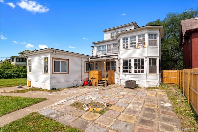 1725 Seyburn St, Detroit, MI 48214 - rear view of house featuring a patio area, a fenced backyard, and an outdoor fire pit