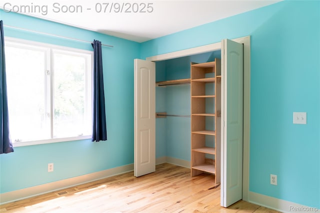 3580 Hazelton Ave, Rochester Hills, MI 48307 - unfurnished bedroom with wood finished floors and a closet