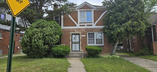 15744 Ferguson St, Detroit, MI 48227 - view of front of property featuring brick siding and a front yard