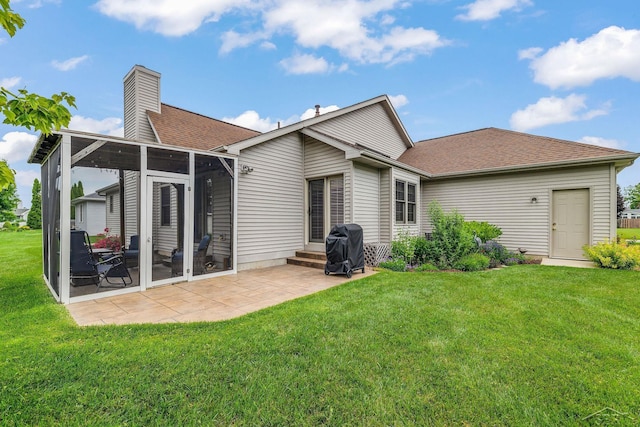 1381 Briarson Dr, Saginaw, MI 48638 - back of property featuring a patio, a yard, a chimney, and roof with shingles
