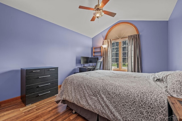 1381 Briarson Dr, Saginaw, MI 48638 - bedroom with vaulted ceiling, wood finished floors, and a ceiling fan