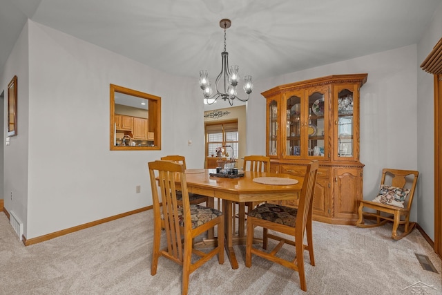 1381 Briarson Dr, Saginaw, MI 48638 - dining space featuring a chandelier and light carpet