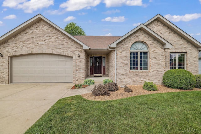 1381 Briarson Dr, Saginaw, MI 48638 - single story home with concrete driveway, a garage, brick siding, and a front yard
