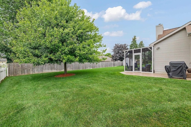 1381 Briarson Dr, Saginaw, MI 48638 - fenced backyard with a sunroom and a patio area