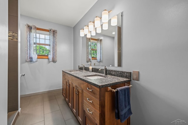 1381 Briarson Dr, Saginaw, MI 48638 - bathroom featuring plenty of natural light, double vanity, and tile patterned floors