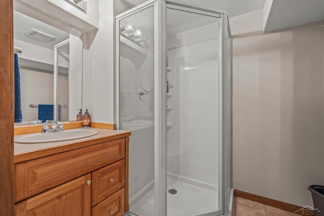 1381 Briarson Dr, Saginaw, MI 48638 - bathroom with a shower stall, tile patterned floors, and vanity
