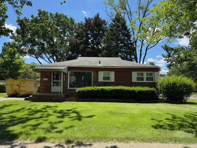 30721 Hathaway, Livonia, MI 48150 - view of front facade with a front yard, brick siding, and a chimney