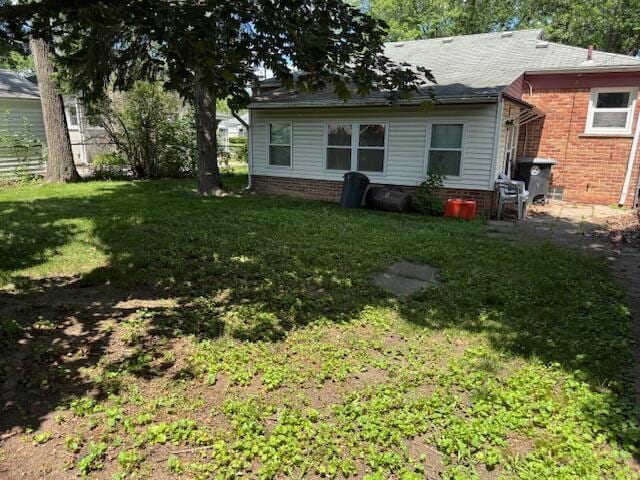 30721 Hathaway, Livonia, MI 48150 - rear view of house featuring a lawn and brick siding