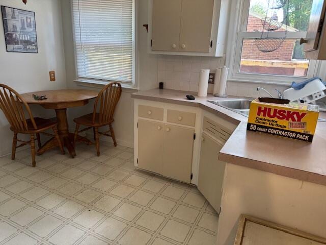 30721 Hathaway, Livonia, MI 48150 - kitchen featuring light countertops, plenty of natural light, light flooring, and tasteful backsplash
