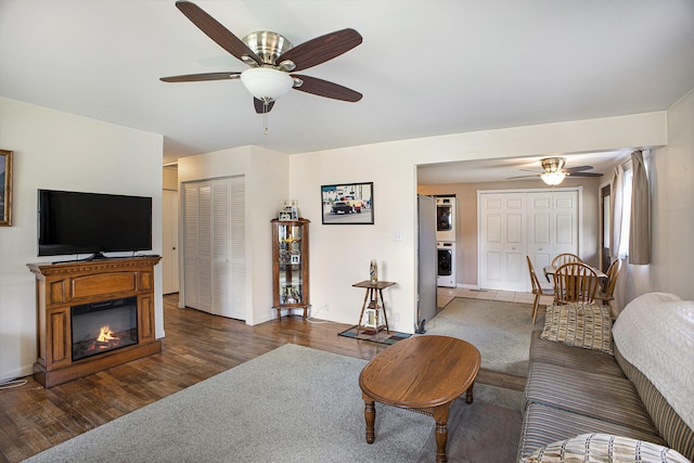 5468 Wellesley Dr, Jackson, MI 49201 - living area with ceiling fan, wood finished floors, and a glass covered fireplace