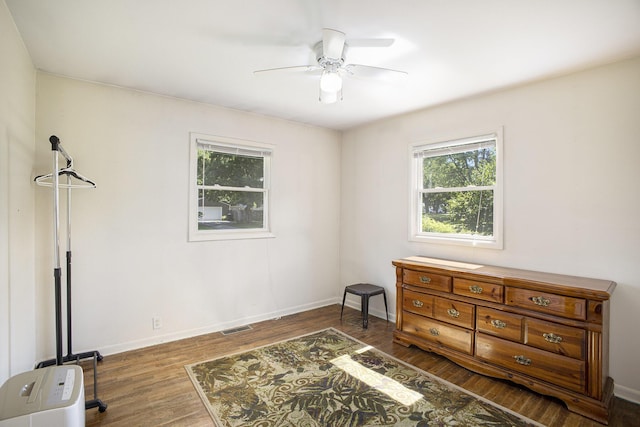 5468 Wellesley Dr, Jackson, MI 49201 - bedroom with multiple windows, wood finished floors, and ceiling fan