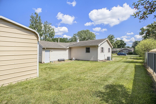 5468 Wellesley Dr, Jackson, MI 49201 - back of house with roof with shingles