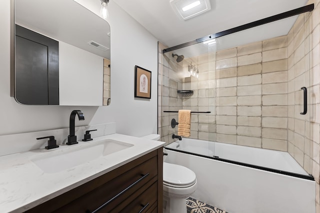 9442 Community Hall Rd, Union Pier, MI 49129 - full bathroom featuring vanity and bath / shower combo with glass door