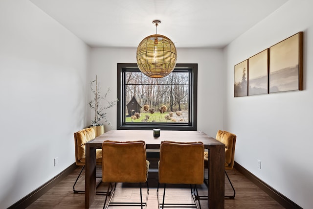 9442 Community Hall Rd, Union Pier, MI 49129 - dining space featuring dark wood-type flooring and a chandelier
