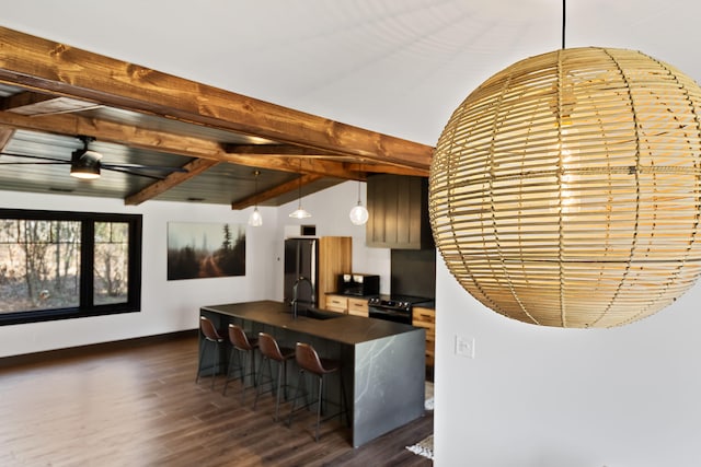 9442 Community Hall Rd, Union Pier, MI 49129 - kitchen with dark countertops, black appliances, dark wood-style floors, hanging light fixtures, and beam ceiling