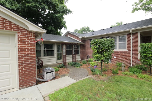 41079 E Ann Arbor Trl, Plymouth, MI 48170 - entrance to property with brick siding and an attached garage