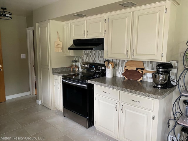 41079 E Ann Arbor Trl, Plymouth, MI 48170 - kitchen featuring black / electric stove, under cabinet range hood, decorative backsplash, light tile patterned floors, and white cabinetry
