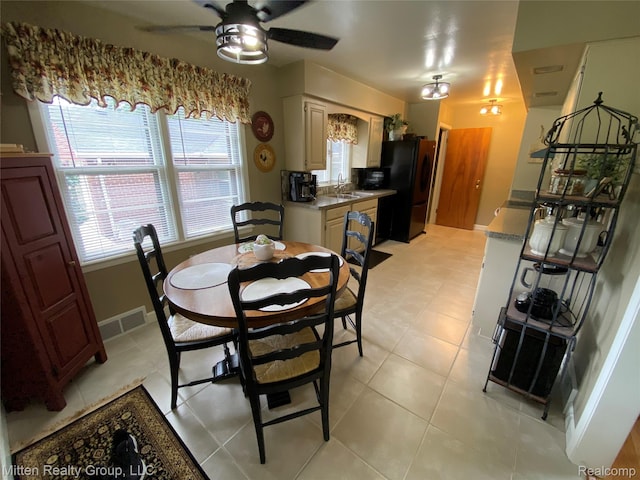 41079 E Ann Arbor Trl, Plymouth, MI 48170 - dining area with ceiling fan and light tile patterned floors