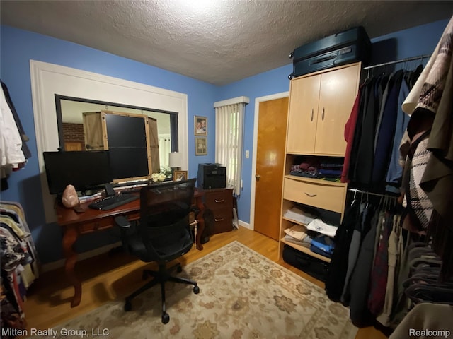 41079 E Ann Arbor Trl, Plymouth, MI 48170 - home office with wood finished floors and a textured ceiling
