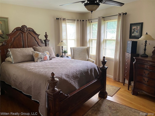 41079 E Ann Arbor Trl, Plymouth, MI 48170 - bedroom featuring light wood-type flooring and ceiling fan