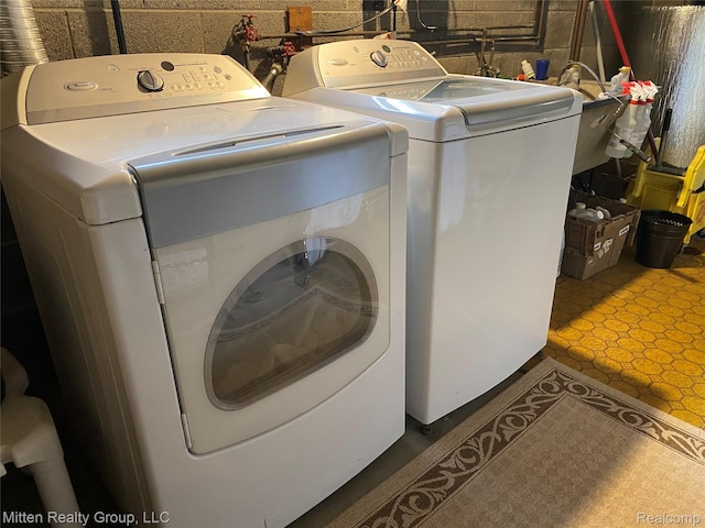 41079 E Ann Arbor Trl, Plymouth, MI 48170 - laundry area with washing machine and dryer and tile patterned floors