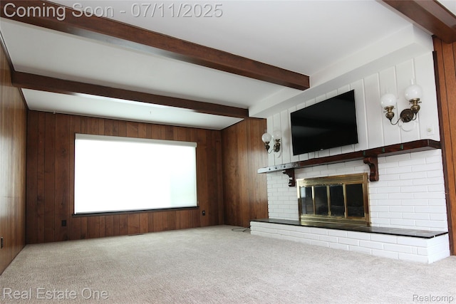 53347 Mark Dr, Shelby Twp, MI 48316 - unfurnished living room with beamed ceiling, carpet, a brick fireplace, and wooden walls