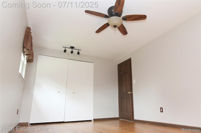 53347 Mark Dr, Shelby Twp, MI 48316 - unfurnished bedroom featuring wood finished floors, a closet, and ceiling fan