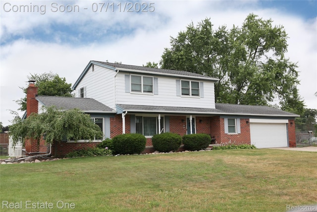 53347 Mark Dr, Shelby Twp, MI 48316 - traditional home featuring an attached garage, brick siding, a front yard, driveway, and a chimney