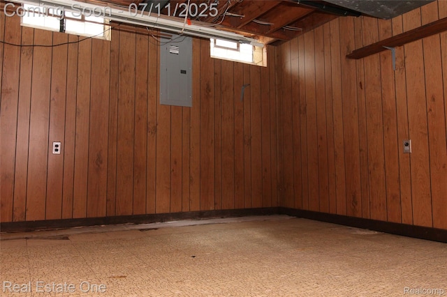53347 Mark Dr, Shelby Twp, MI 48316 - basement featuring electric panel, wood walls, and tile patterned floors