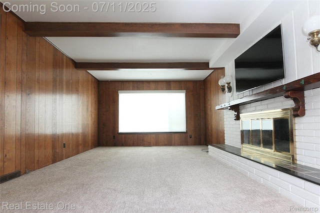 53347 Mark Dr, Shelby Twp, MI 48316 - unfurnished living room featuring beam ceiling, wooden walls, carpet floors, and a brick fireplace