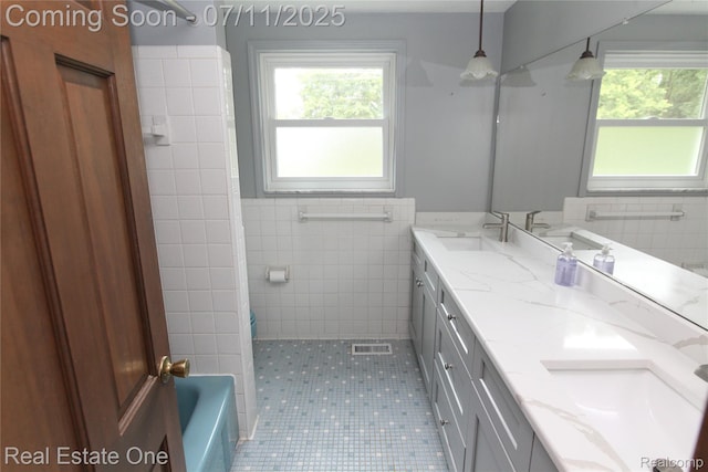 53347 Mark Dr, Shelby Twp, MI 48316 - bathroom with tile walls, double vanity, and tile patterned floors