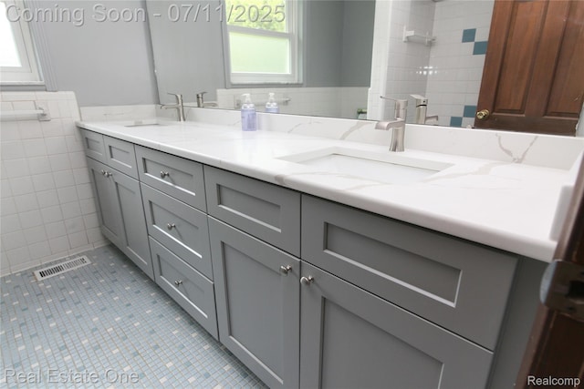 53347 Mark Dr, Shelby Twp, MI 48316 - full bathroom with tile walls, double vanity, and tile patterned flooring