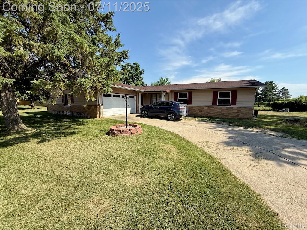 1035 W Pine Ave, Mount Morris, MI 48458 - ranch-style house with brick siding, an attached garage, driveway, and a front yard