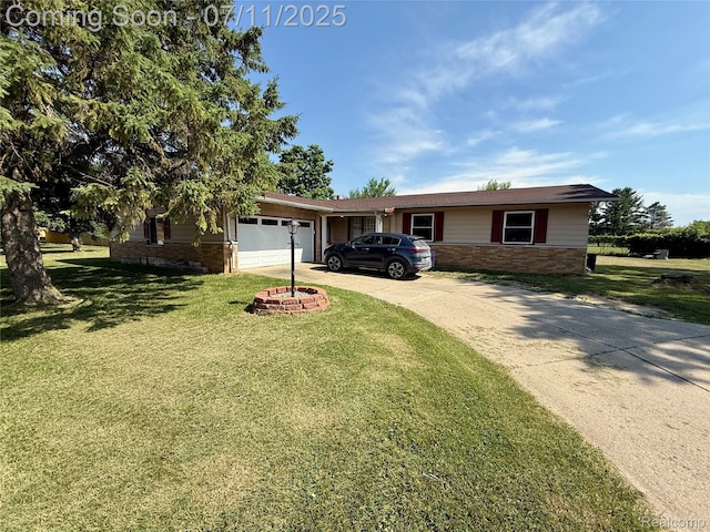 1035 W Pine Ave, Mount Morris, MI 48458 - ranch-style house with brick siding, an attached garage, driveway, and a front yard
