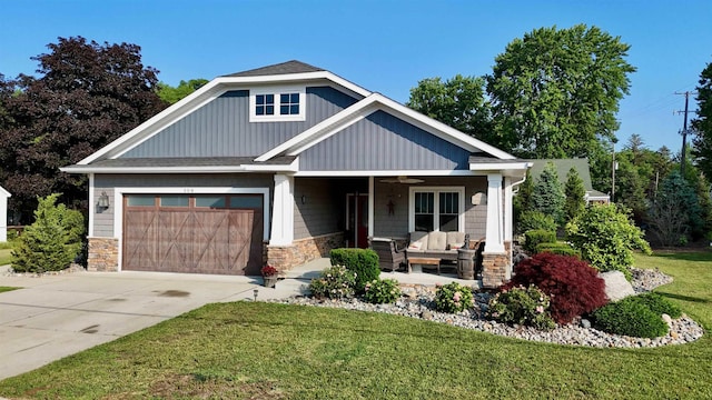 308 W Hosmer St, Saint Charles, MI 48655 - craftsman-style home featuring a ceiling fan, a garage, an outdoor hangout area, a front yard, and stone siding