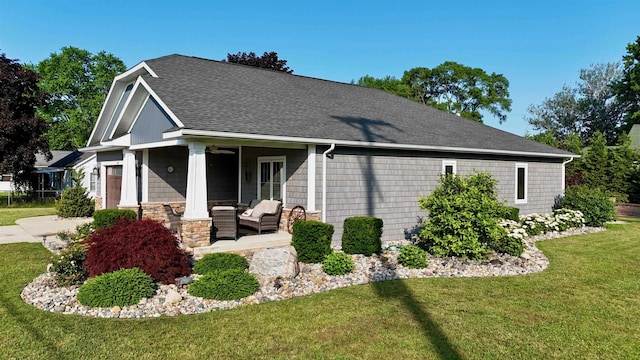 308 W Hosmer St, Saint Charles, MI 48655 - view of front of home with a front lawn, outdoor lounge area, a shingled roof, a garage, and ceiling fan