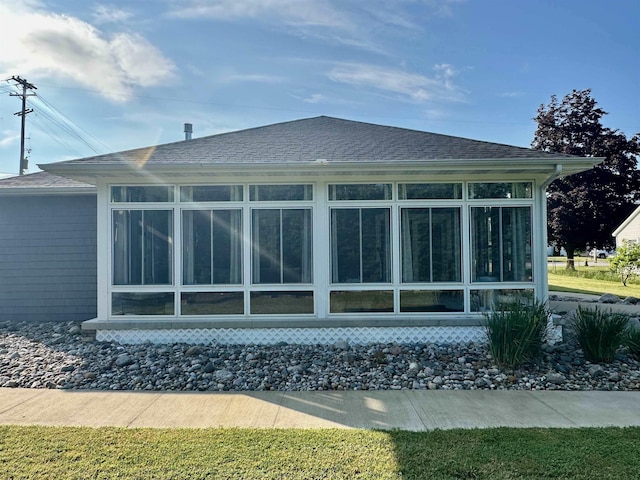 308 W Hosmer St, Saint Charles, MI 48655 - back of house with a sunroom and a shingled roof