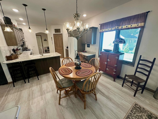 308 W Hosmer St, Saint Charles, MI 48655 - dining room featuring arched walkways, a chandelier, and recessed lighting