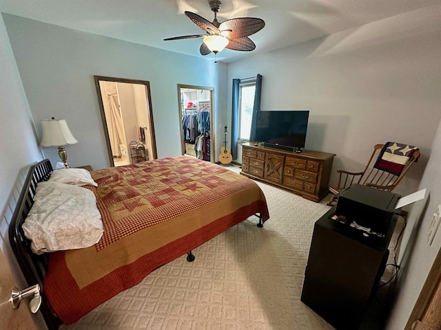 308 W Hosmer St, Saint Charles, MI 48655 - bedroom featuring a spacious closet, a closet, a ceiling fan, and light colored carpet