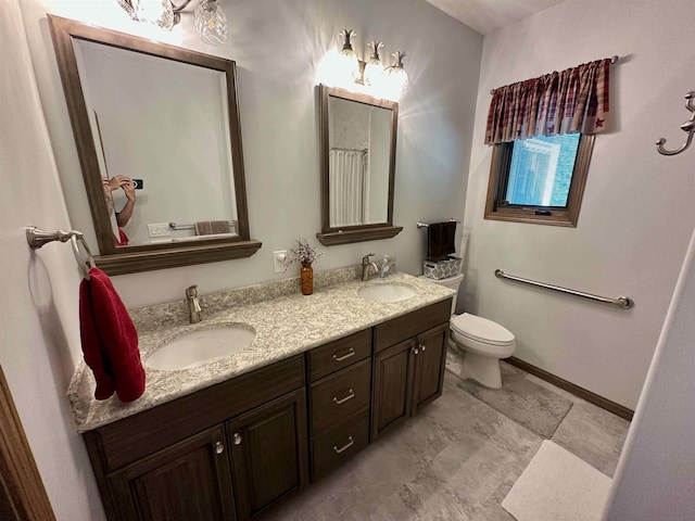 308 W Hosmer St, Saint Charles, MI 48655 - bathroom with double vanity and toilet