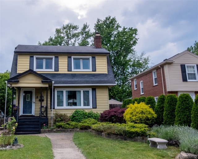 1036 Irving Ave, Royal Oak, MI 48067 - view of front facade featuring a chimney, a front lawn, and a shingled roof
