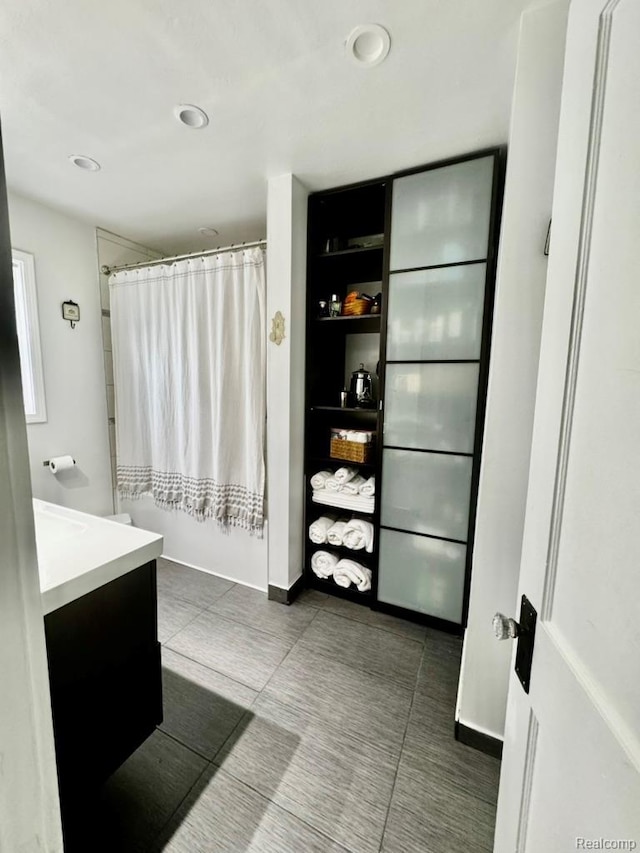 1036 Irving Ave, Royal Oak, MI 48067 - full bathroom with vanity, curtained shower, tile patterned floors, and recessed lighting