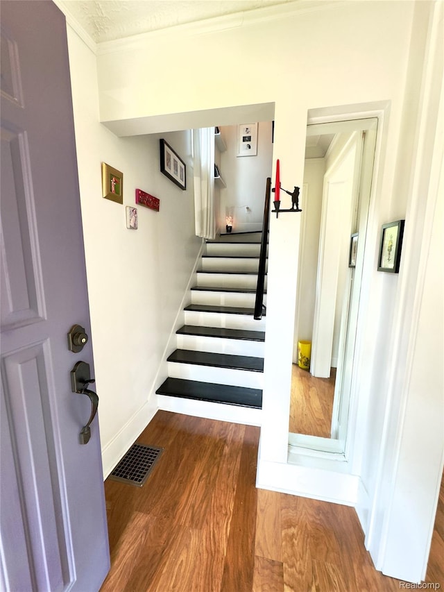 1036 Irving Ave, Royal Oak, MI 48067 - stairs featuring crown molding and wood finished floors