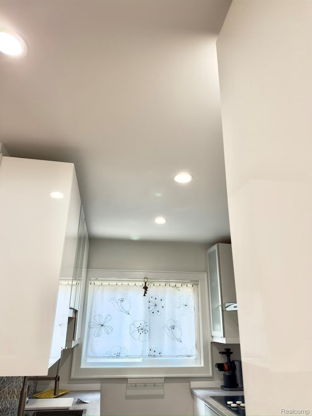 1036 Irving Ave, Royal Oak, MI 48067 - kitchen view of recessed lighting and black electric cooktop