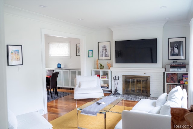 1036 Irving Ave, Royal Oak, MI 48067 - living room with crown molding, wood finished floors, and a brick fireplace