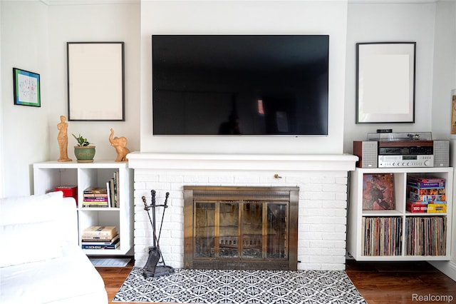 1036 Irving Ave, Royal Oak, MI 48067 - living area featuring a brick fireplace and wood finished floors
